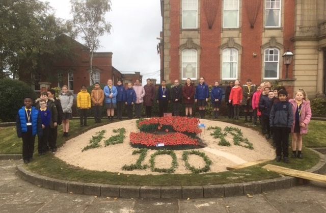 Local children stood by the flower bed outside Chadderton Town Hall
