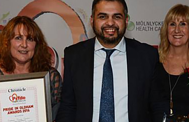 Majid Hussain, pictured (centre) at the 2016 Pride in Oldham Awards event