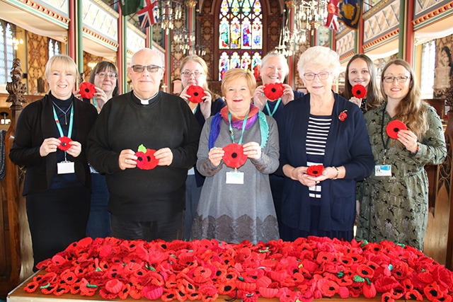 Pictured, from left to right, are: Diane Outram, Alison Riley, Vicar Derek Palmer, Victoria Caldwell, Shena Cuming, Christine Quinn, Marlene Armitage, Lorna Barry and Linda Gunner