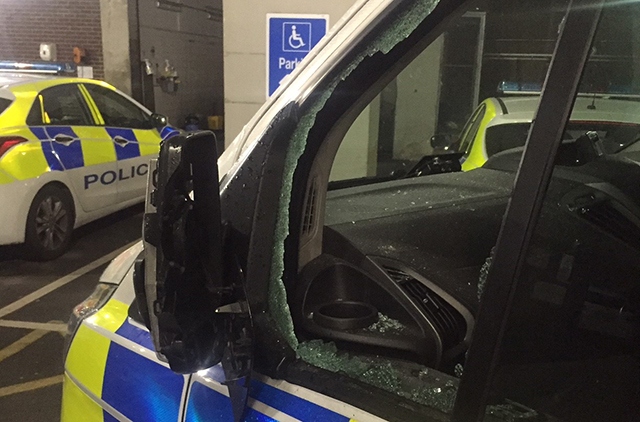 A police car was attacked with an axe in the robbery in Oldham