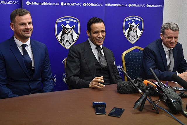Low profile: Athletic's Moroccan owner Abdallah Lemsagam pictured (centre) at his unveiling in January. Then manager Richie Wellens (left) and then chief executive Mark Moisley were soon shown the door. Low profile: Athletic's Moroccan owner Abdallah Lemsagam pictured (centre) at his unveiling in January. Then manager Richie Wellens (left) and then chief executive Mark Moisley were soon shown the door.