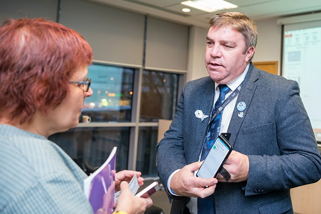 TfGM Chair, Councillor Mark Aldred, speaks to Geraldine Hills, whose son, Sam Hills, has benefitted from the training