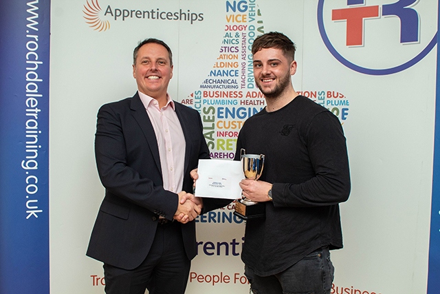 Oldham-based Brett Wardrope (right), of Hellermann Tyton, receives his Advanced Engineering Level 3 award  