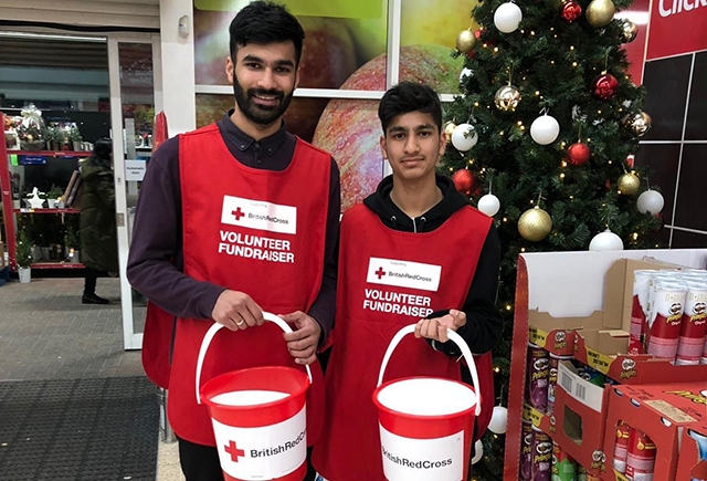 Pictured are Aqib Ahmed and Ghalib Ahmed, members of Ahmadiyya Muslim Youth Oldham