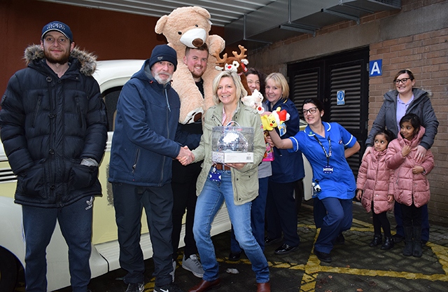 Pictured (left to right) are members of the Rainy City Cruisers hot rod car club with Penny Martin and staff from the Royal Oldham Hospital children’s ward Pictured (left to right) are members of the Rainy City Cruisers hot rod car club with Penny Martin and staff from the Royal Oldham Hospital children’s ward