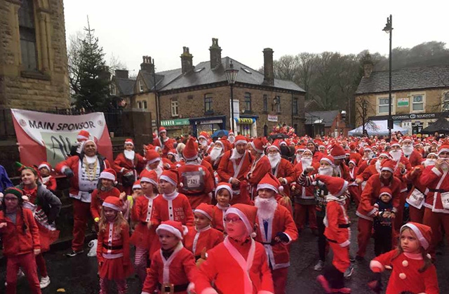 The scene at the Santa Dash in Uppermill on Saturday