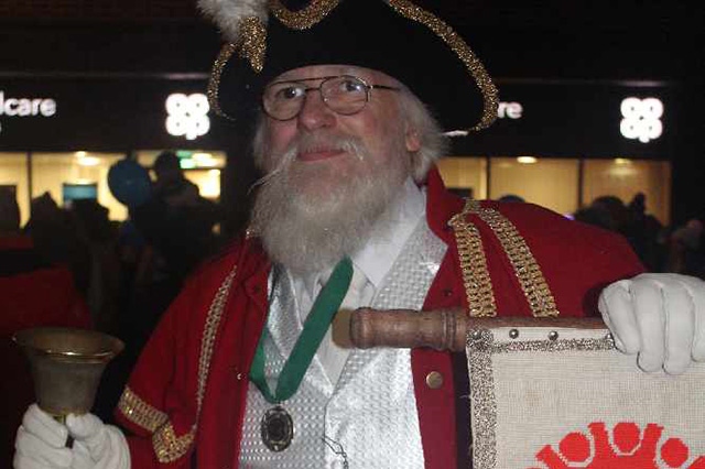 The town crier put in an appearance at the Shaw lights switch-on