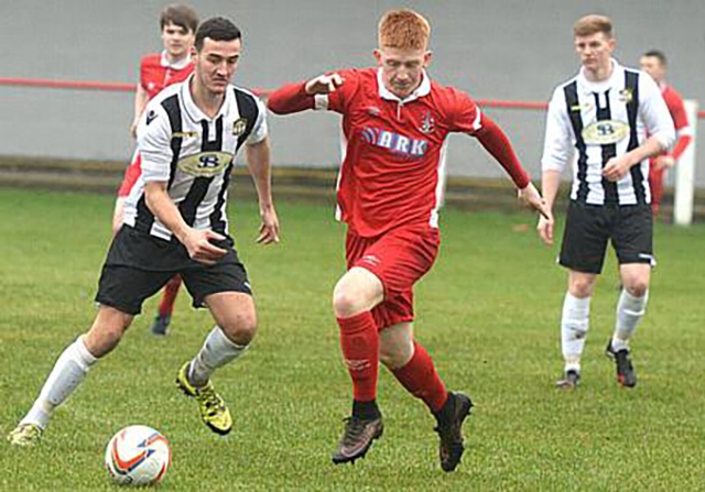 Aaron Scholes (centre) notched a late point-saver for Chadderton