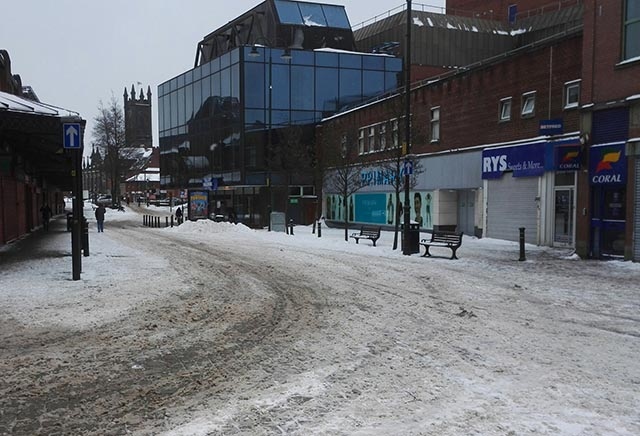 The chilly and deserted scene by the market hall in Oldham at 4pm today 