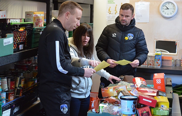 Athletic manager Richie Wellens (right) and first team coach Paul Terry took supplies to Oldham Foodbank