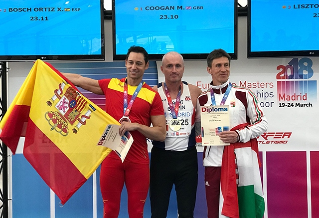 Failsworth's Mike Coogan (centre) celebrates his victory in Madrid