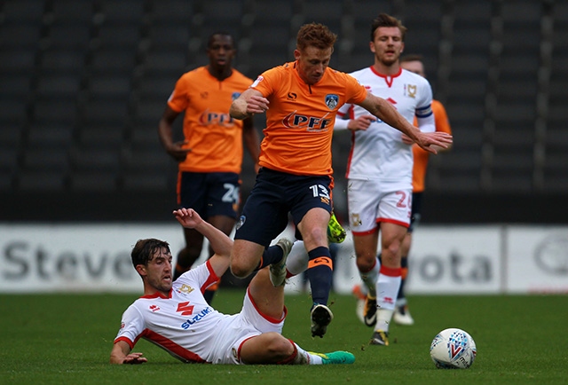 Eoin Doyle (centre) returned to action with a vital goal at Scunthorpe