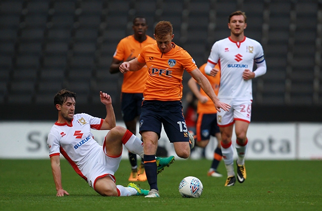 Eoin Doyle (centre) will be looking to get among the goals again at Bury having scored on his return to action last weekend