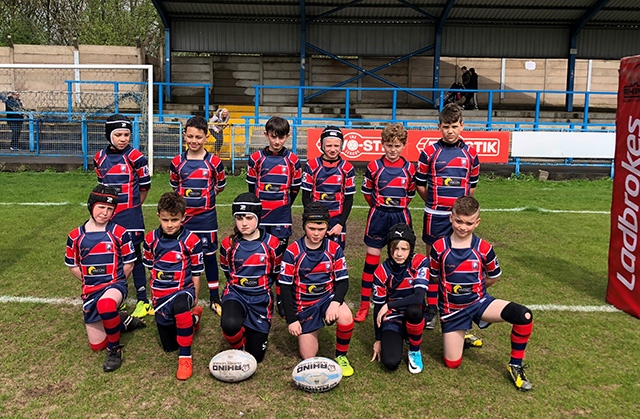 Limehurst Lions under-10s on the pitch at Bower Fold. They are (back row): Dylan Rodgerson, Kye Syed, Jake Cooper, Lewis Owens, Charlie Cooper and Reece Sewell. Front: Harry Schofield, Ben Meah, Kadie Ashworth, James Woods, Eleanor Crossly and McKenzie Degnan. 
