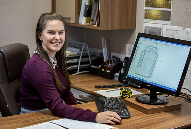 Designer Mica Wood at her desk