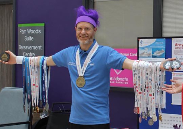 Stewart Jones shows off his medals at World Kidney Day