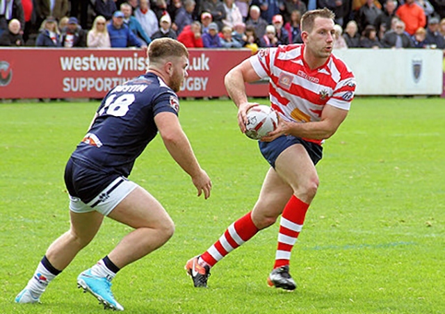 Oldham prop Adam Neal (right)