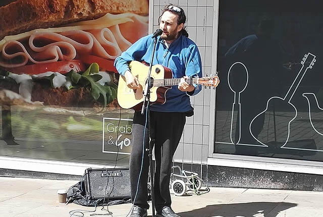 Dave struts his stuff outside Home Bargains in Oldham town centre Dave struts his stuff outside Home Bargains in Oldham town centre