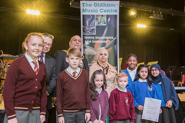 Pictured are Mayor of Oldham Javid Iqbal and Mayoress of Oldham Tasleem Akhtar with young musicians who performed at the festival