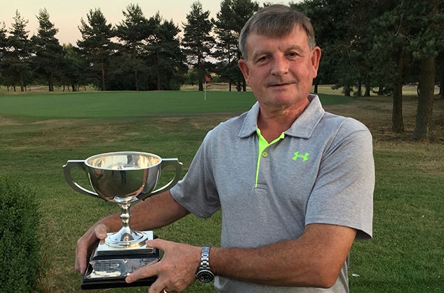 Mark Riley shows off his silverware