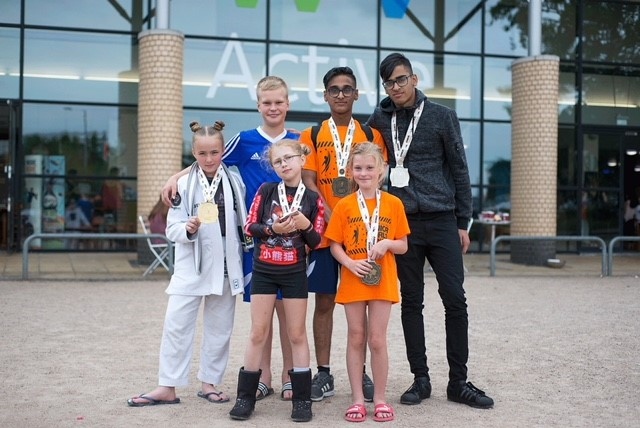 Stealth Brazilian Jiu-Jitsu Youth team members show off their silverware