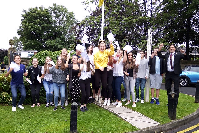 What a celebration! Crompton House head teacher Karl Newell enjoys A-level results morning with some of his students