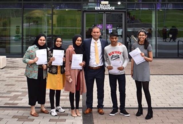 Oldham Academy North Headteacher Chris Davis with the school's top five achievers Oldham Academy North Headteacher Chris Davis with the school's top five achievers