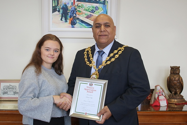 Ashleigh receiving her award from the Mayor of Oldham Councillor Javid Iqbal 