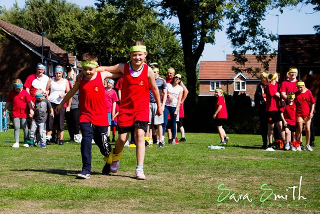 Children take part in a three legged race for the Cobra Kan Karate Do sports day.