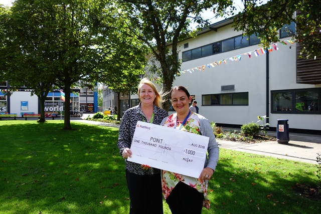 POINT collects the cheque from Oldham College