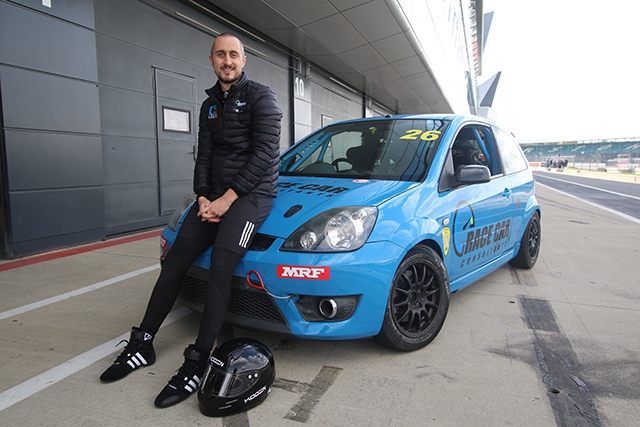 Chris Loder pictured at Silverstone with his car Chris Loder pictured at Silverstone with his car