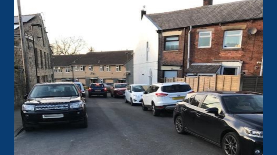 Cars overcrowding residential streets.