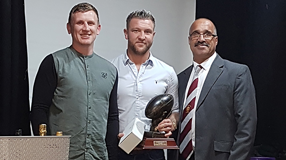 Ritchie Hawkard (centre) won two awards, voted top gun by his fellow players and by the coach. He's flanked by club captain Gareth Owen and Joe Warburton of the Past Players, who sponsored the players' award Ritchie Hawkard (centre) won two awards, voted top gun by his fellow players and by the coach. He's flanked by club captain Gareth Owen and Joe Warburton of the Past Players, who sponsored the players' award