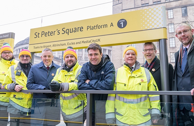 KeolisAmey Customer Service Representatives (yellow jackets) with (left to right) Danny Vaughan – TfGM’s Head of Metrolink, Greater Manchester Mayor Andy Burnham, Stephen Rhodes – TfGM’s Customer Director and Rob Cox – Director of Service Delivery at KeolisAmey Metrolink 