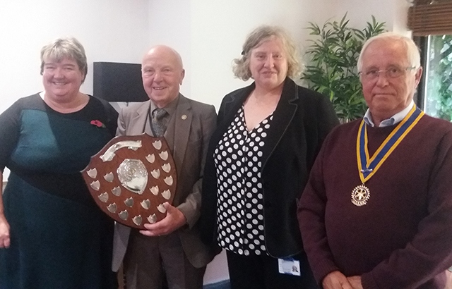 Our picture shows Rotary President Colin Platt presenting the award to this year's winner - Christies Oldham - to Julie Davies and Helen Murphy from the clinic, with Rotary Community Service chairman Ray Coverley