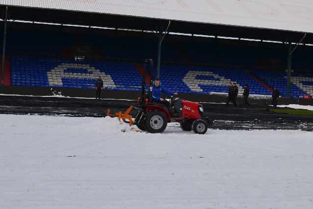 Staff and supporters help clear the snow at Boundary Park Staff and supporters help clear the snow at Boundary Park