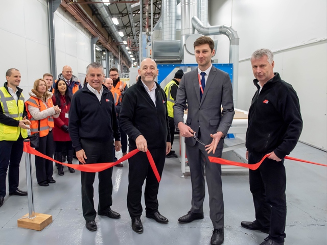 Cllr Sean Fielding, centre, cutting the ribbon at HPP’s new vinyl-wrapped door production line with, from left, Richard Mottram, Keith Wardrope and Stephen Hill, all from HPP. 