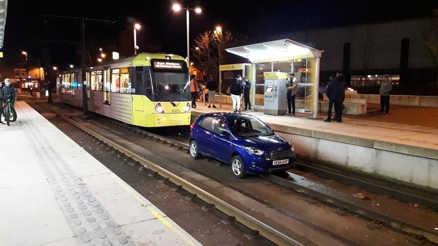 Car on the tram track in Oldham