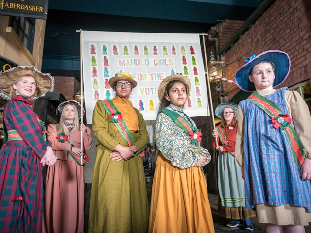 Young people who are taking part in the Game Changers project who visited Salford Museum to dress as suffragists for inspiration