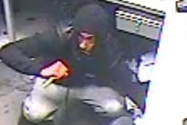 The man entered the betting shop armed with a large knife
