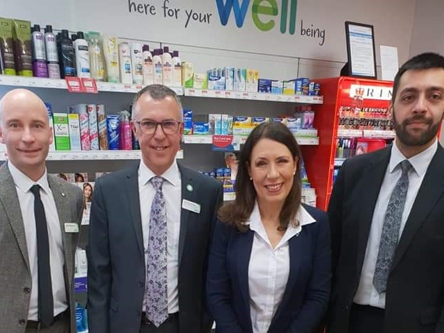 Debbie Abrahams with staff at Well Pharmacy Uppermill 