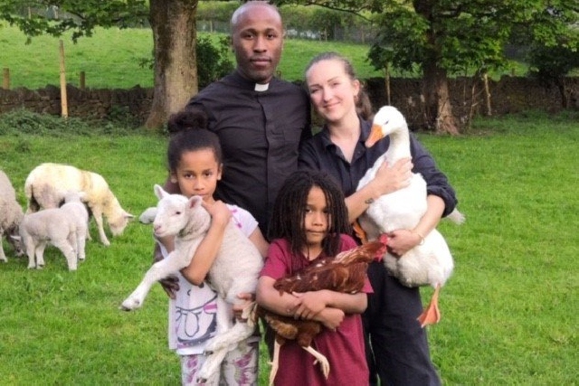 Rev Jackman abd his wife Gemma are pictured with  Hope, holding Dobby the Lamb,  Abraham holding Zoe the Hen, and Mrs Jackman is  holding the goose  Little Richard