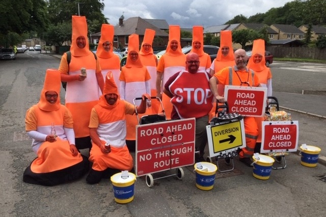 The road sign team headed by brother and sister Angie and Justin Brown, the walk’s organisers.