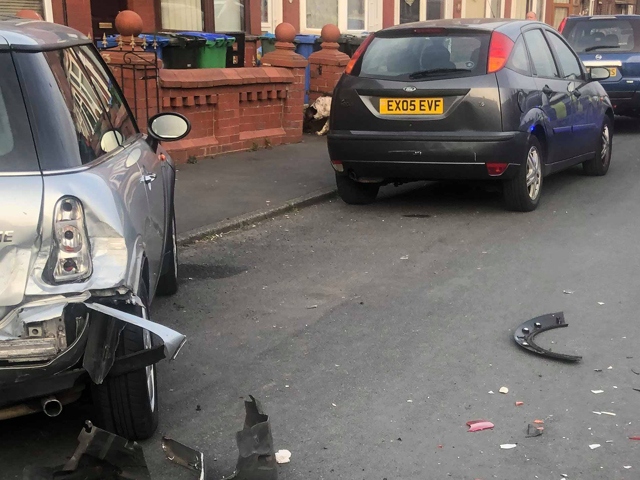 Scene after car crashed into parked vehicles in Wolsey Street, Heywood