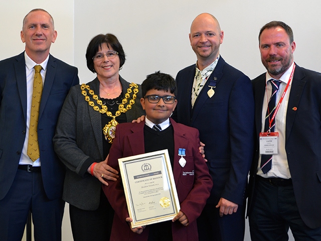 Ibrahim receiving his British Citizen Youth Award 