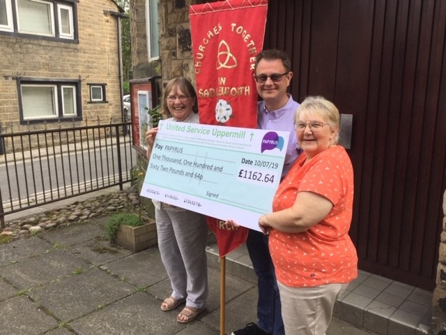 Cheque mates: Pictured are Rev Audrey Lee and Hilary Yates from Ebenezer, and Adrian Green of Uppermill Methodist Church