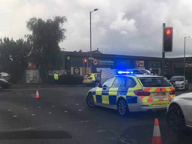 Police cars attend the scene in Hyde