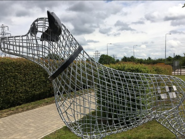 A wire sculpture of a dog is proposed to be a memorial at the Denton branch of the Dogs Trust in Greater Manchester.