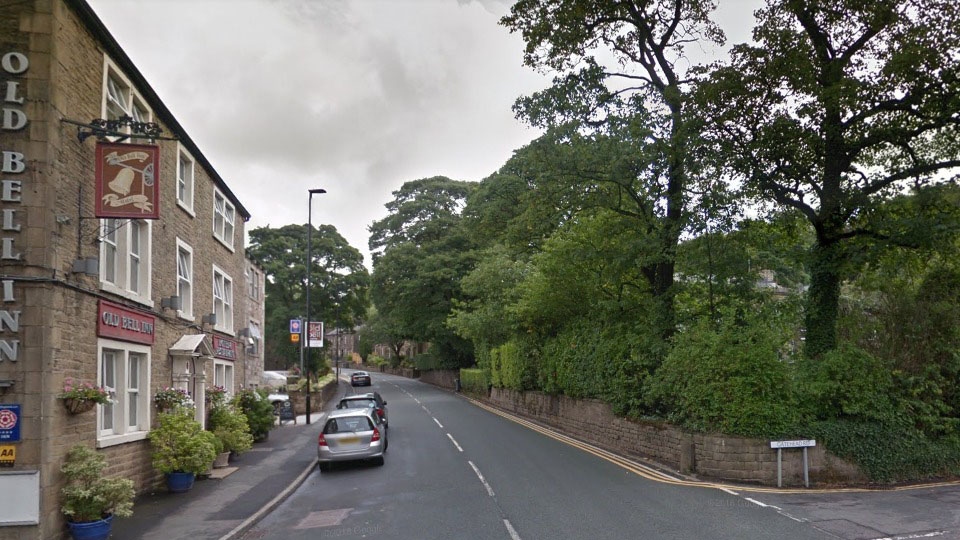 Huddersfield Road at the junction with Gatehead Road in Delph, Oldham. 