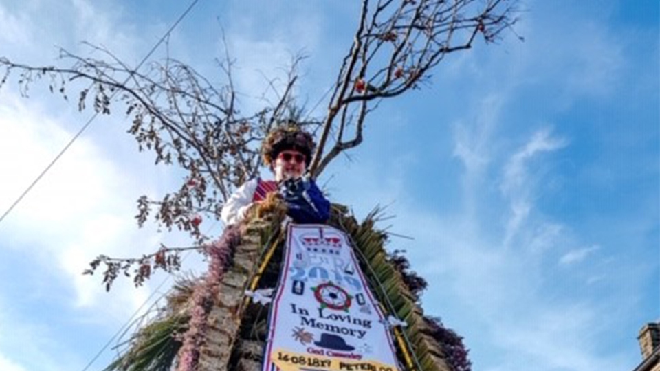 Saddleworth Morris Mens Jockey Carl Taylor rides the emblematic Rushcart